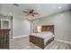 Spacious bedroom with a ceiling fan and ensuite bathroom access at 29923 W Melvin St, Buckeye, AZ 85396