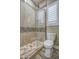 Clean bathroom with a large walk-in shower and toilet at 29923 W Melvin St, Buckeye, AZ 85396