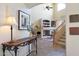 Elegant entryway with a console table and view of the staircase at 18516 W Sweet Acacia Dr, Goodyear, AZ 85338