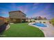 Large backyard with pool and two story home at 18516 W Sweet Acacia Dr, Goodyear, AZ 85338