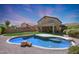 Large backyard with pool and two story home at 18516 W Sweet Acacia Dr, Goodyear, AZ 85338