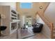 Spacious living area with a fireplace and backyard access at 18516 W Sweet Acacia Dr, Goodyear, AZ 85338