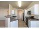 Clean and efficient kitchen with white cabinets at 1941 S Pierpont Dr # 1038, Mesa, AZ 85206