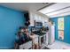 Bright kitchen with white cabinets and blue walls at 3119 W Cochise Dr # 245, Phoenix, AZ 85051