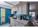 Bright kitchen with white cabinets, stainless steel sink, and modern appliances at 3119 W Cochise Dr # 245, Phoenix, AZ 85051