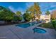 Community pool and spa with surrounding landscaping at 3119 W Cochise Dr # 245, Phoenix, AZ 85051