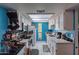 Full kitchen view, white cabinets, blue walls at 3119 W Cochise Dr # 245, Phoenix, AZ 85051