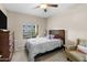 Bedroom with large window, dresser, and comfortable bed at 5450 E Deer Valley Dr # 3004, Phoenix, AZ 85054