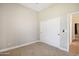 Bedroom with carpet, window, and neutral wall colors at 28131 N Marchant Trce, Queen Creek, AZ 85142