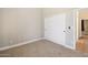 Bedroom with carpet, window, and neutral wall colors at 28131 N Marchant Trce, Queen Creek, AZ 85142