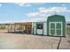 Chicken coop and barn with green and white paint at 28131 N Marchant Trce, Queen Creek, AZ 85142