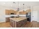 Modern kitchen with wood cabinets and granite countertops at 28131 N Marchant Trce, Queen Creek, AZ 85142