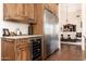 Kitchen features a wine cooler and custom wood cabinetry at 6610 E Barwick Dr, Cave Creek, AZ 85331