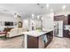 Open concept kitchen with island, stainless steel appliances, and views to the living room at 2247 E Indian Wells Dr, Gilbert, AZ 85298