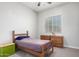 Simple bedroom with a twin bed and wooden dresser at 2247 E Indian Wells Dr, Gilbert, AZ 85298
