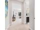 Bright hallway with carpet flooring and access to bathroom and bedroom at 2247 E Indian Wells Dr, Gilbert, AZ 85298