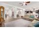 Open living room with a comfortable couch and view into kitchen at 2247 E Indian Wells Dr, Gilbert, AZ 85298