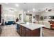 Modern kitchen with an island, dark wood cabinets, and a large window at 2247 E Indian Wells Dr, Gilbert, AZ 85298