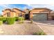 Beautiful one-story home with a welcoming front porch and landscaping at 2247 E Indian Wells Dr, Gilbert, AZ 85298
