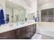 Bathroom with double sinks, soaking tub, and separate shower at 2247 E Indian Wells Dr, Gilbert, AZ 85298