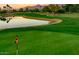 Stunning sunset view over the manicured greens of the golf course at 18830 E White Wing Dr, Rio Verde, AZ 85263