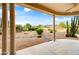 Covered patio with desert landscaping and mountain views at 18830 E White Wing Dr, Rio Verde, AZ 85263