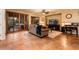 Living room with comfortable seating, a large TV and patio access at 23012 N Giovota Dr, Sun City West, AZ 85375