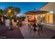 Backyard patio with dining area and fire pit at 23012 N Giovota Dr, Sun City West, AZ 85375