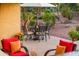 Outdoor patio furniture under an umbrella, next to the house at 23012 N Giovota Dr, Sun City West, AZ 85375
