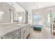 Elegant bathroom with a soaking tub, walk-in shower, and marble finishes at 8742 E Villa Cassandra Dr, Scottsdale, AZ 85266