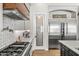 Stylish kitchen features stainless steel appliances, custom cabinetry and designer backsplash at 8742 E Villa Cassandra Dr, Scottsdale, AZ 85266
