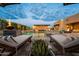 Luxury pool with waterfall feature and fire pit at 8742 E Villa Cassandra Dr, Scottsdale, AZ 85266
