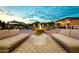 Peaceful backyard oasis with fire pit and lounge seating at 8742 E Villa Cassandra Dr, Scottsdale, AZ 85266