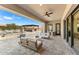 Relaxing covered patio with comfortable seating and outdoor kitchen at 8742 E Villa Cassandra Dr, Scottsdale, AZ 85266