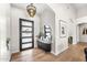 Bright entryway with modern chandelier and console table at 8742 E Villa Cassandra Dr, Scottsdale, AZ 85266