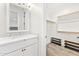 Clean bathroom with white vanity, quartz countertop, and walk-in closet at 8742 E Villa Cassandra Dr, Scottsdale, AZ 85266