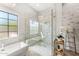 Luxury bathroom with a walk-in shower and a freestanding bathtub at 8742 E Villa Cassandra Dr, Scottsdale, AZ 85266