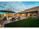 Inviting pool and spa area with fire pit and outdoor kitchen at 8742 E Villa Cassandra Dr, Scottsdale, AZ 85266