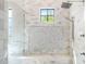 Spa-like shower with marble bench and glass enclosure at 8742 E Villa Cassandra Dr, Scottsdale, AZ 85266