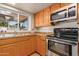 Kitchen features stainless steel appliances and granite countertops at 2705 W Summit Pl, Chandler, AZ 85224