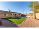 Inviting backyard oasis features a sparkling pool, lush lawn, and covered patio at 2705 W Summit Pl, Chandler, AZ 85224