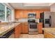 Kitchen with stainless steel appliances and granite countertops at 2705 W Summit Pl, Chandler, AZ 85224