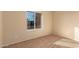 Sunny bedroom featuring a window and neutral carpet at 2705 W Summit Pl, Chandler, AZ 85224