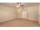 Bright bedroom with neutral carpeting and ceiling fan at 2705 W Summit Pl, Chandler, AZ 85224
