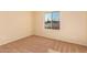 Cozy bedroom with a large window and neutral carpet at 2705 W Summit Pl, Chandler, AZ 85224