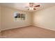 Bright bedroom with neutral carpeting and ceiling fan at 2705 W Summit Pl, Chandler, AZ 85224