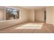 Spacious living area with large window and neutral carpeting at 2705 W Summit Pl, Chandler, AZ 85224