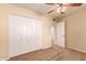 Bright bedroom with double door closet and access to hallway at 2705 W Summit Pl, Chandler, AZ 85224