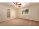 Spacious bedroom with neutral carpeting and ceiling fan at 2705 W Summit Pl, Chandler, AZ 85224