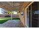 Covered patio with ceiling fans, overlooking a grassy backyard at 2705 W Summit Pl, Chandler, AZ 85224